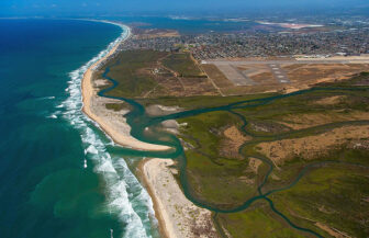 Tijuana Slough National Wildlife Refuge, on the Mexican border south of San Diego, is one of 180 coastal refuges in the National Wildlife Refuge System. Photo by Ralph Lee Hopkins with aerial support by LightHawk